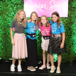 Four GOTR Girls dressed up in dresses and sneakers